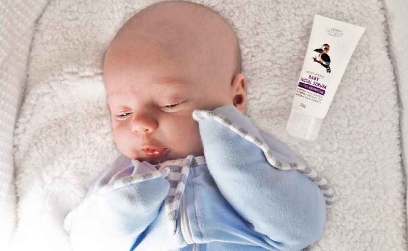 baby in cot with du'it baby facial serum